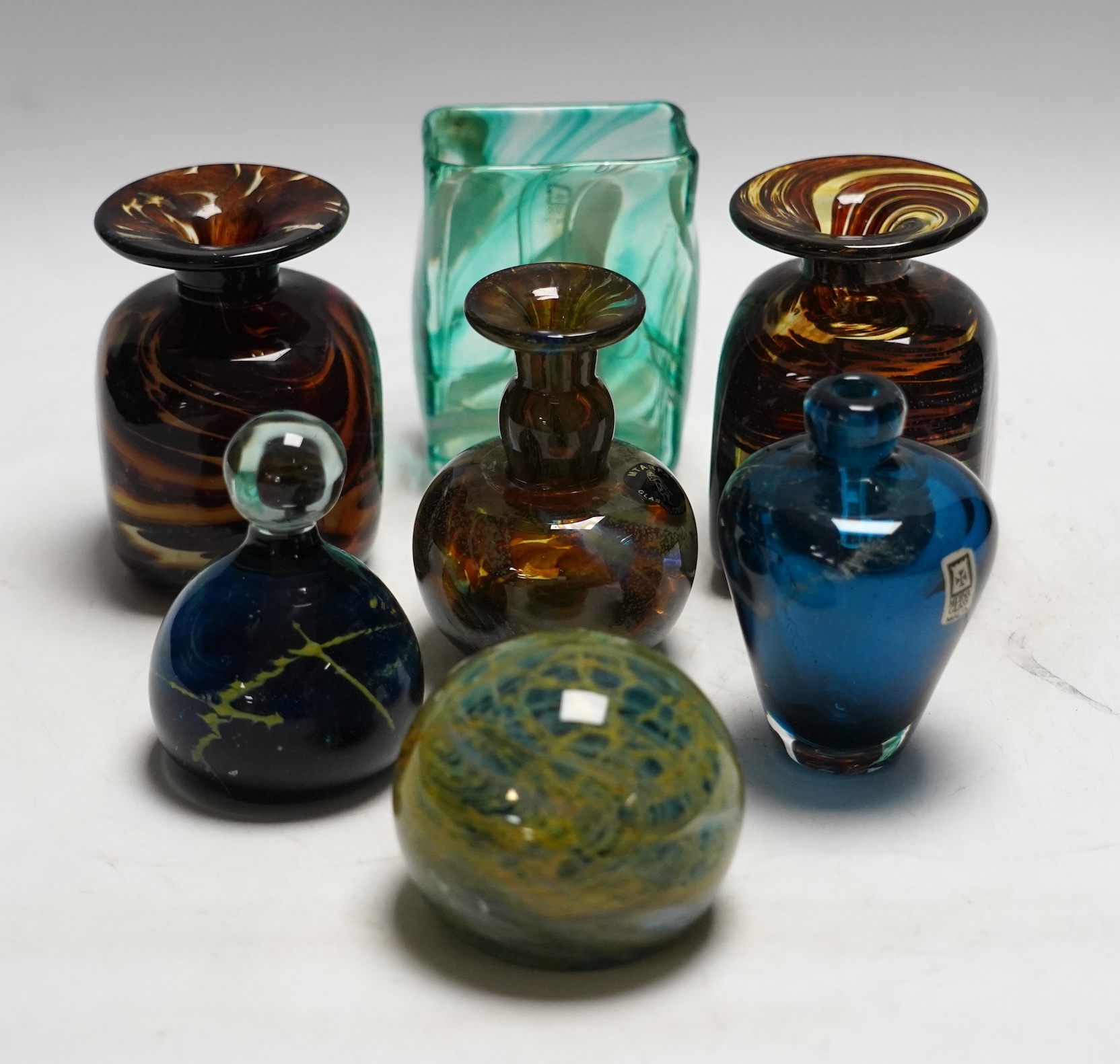 A collection of thirty pieces of Mdina glassware, comprising paperweights and vases, largest 13cm high
